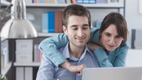 Young Couple shopping for insurance online